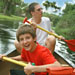 Father and son having fun canoeing through the everglades