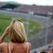 Lady fan watches the Superspeedway race